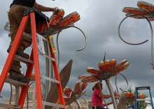 Amie and her husband Tim as they are installing the final pieces of their artwork