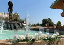 Decorations for a wedding by the fountain. What a beautiful backdrop!